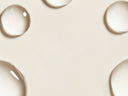 Gouttes de soin sur fond beige Maison Sahéo 